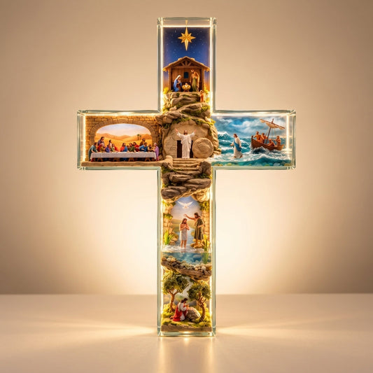 Story of Jesus Light-Up Cross glowing warmly, front view showing six scenes from the life of Jesus